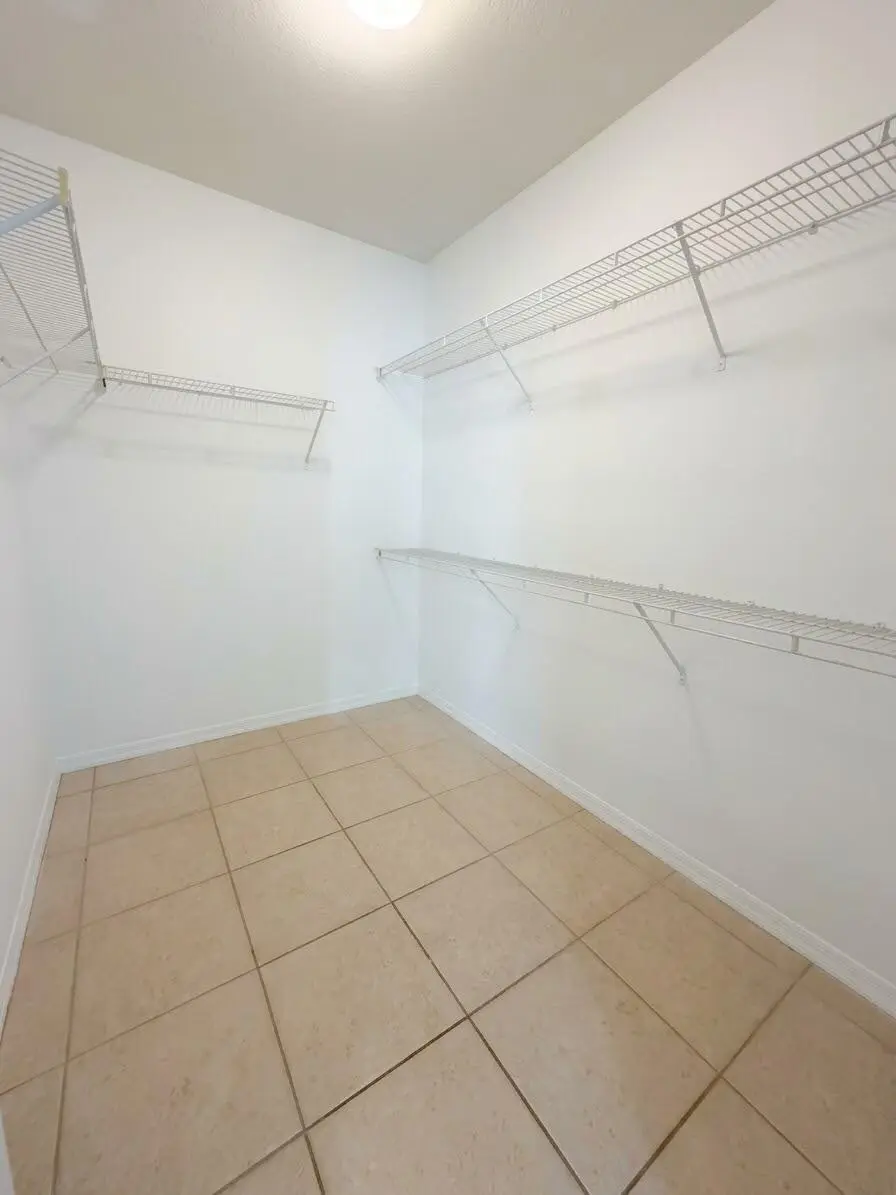 Primary Closet at 6458 EMERALD DUNES Drive 208, West Palm Beach