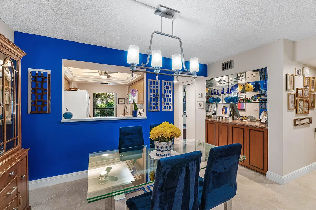 Dining Area w/ Large Opening to Kitchen at 5087 Oakhill Lane, Delray Beach