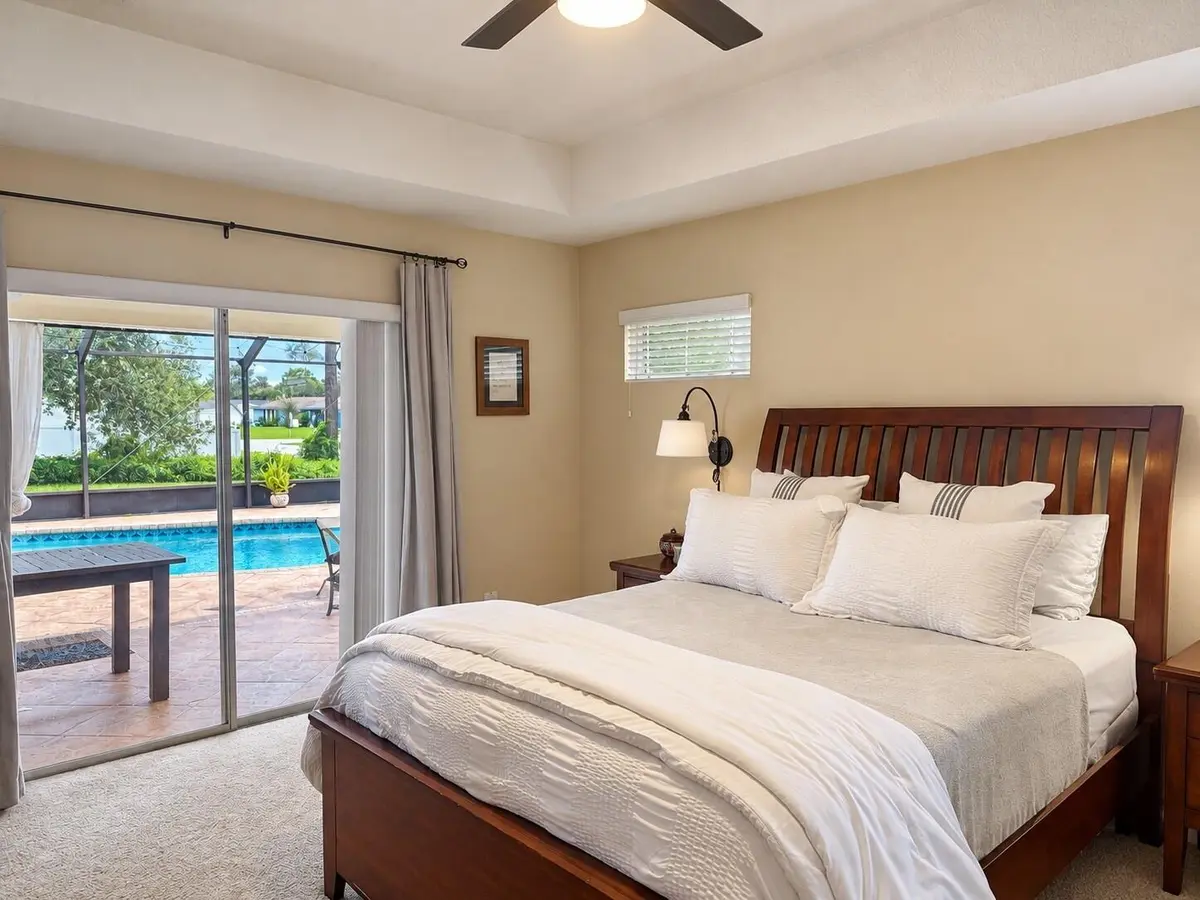 04-Bedroom-and-Pool-Access at 194 SW Voltair Terrace, Port St. Lucie