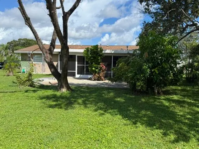 back patio & screen porch at 262 NE Brunson Court, Port St. Lucie
