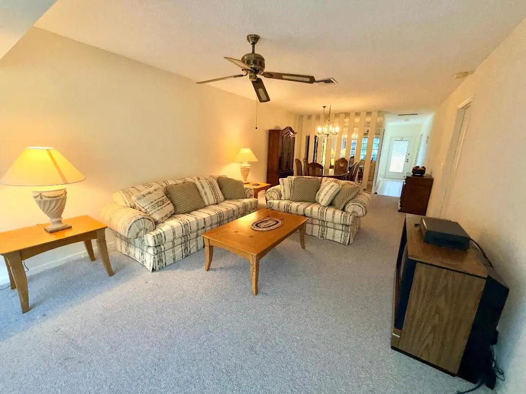 Living room to dining area at 1150 Mahogany Way 203, Delray Beach