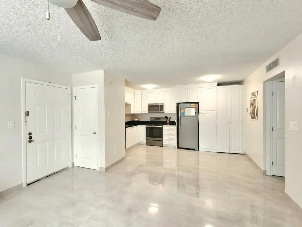 LIVING/DINING AREA at 651 LYONS Road 10107, Coconut Creek
