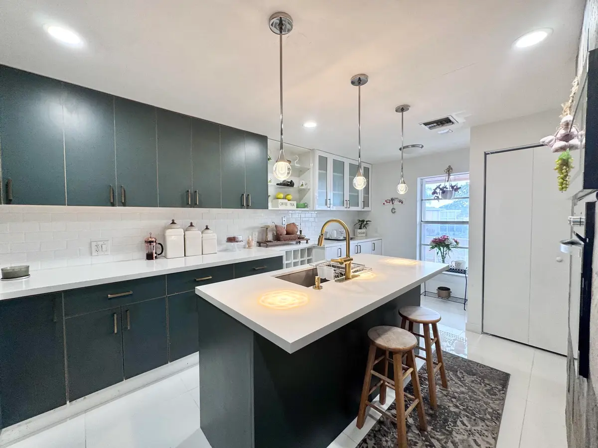 Kitchen Island w Breakfast bar at 1341 NW 20TH Avenue 203, Delray Beach