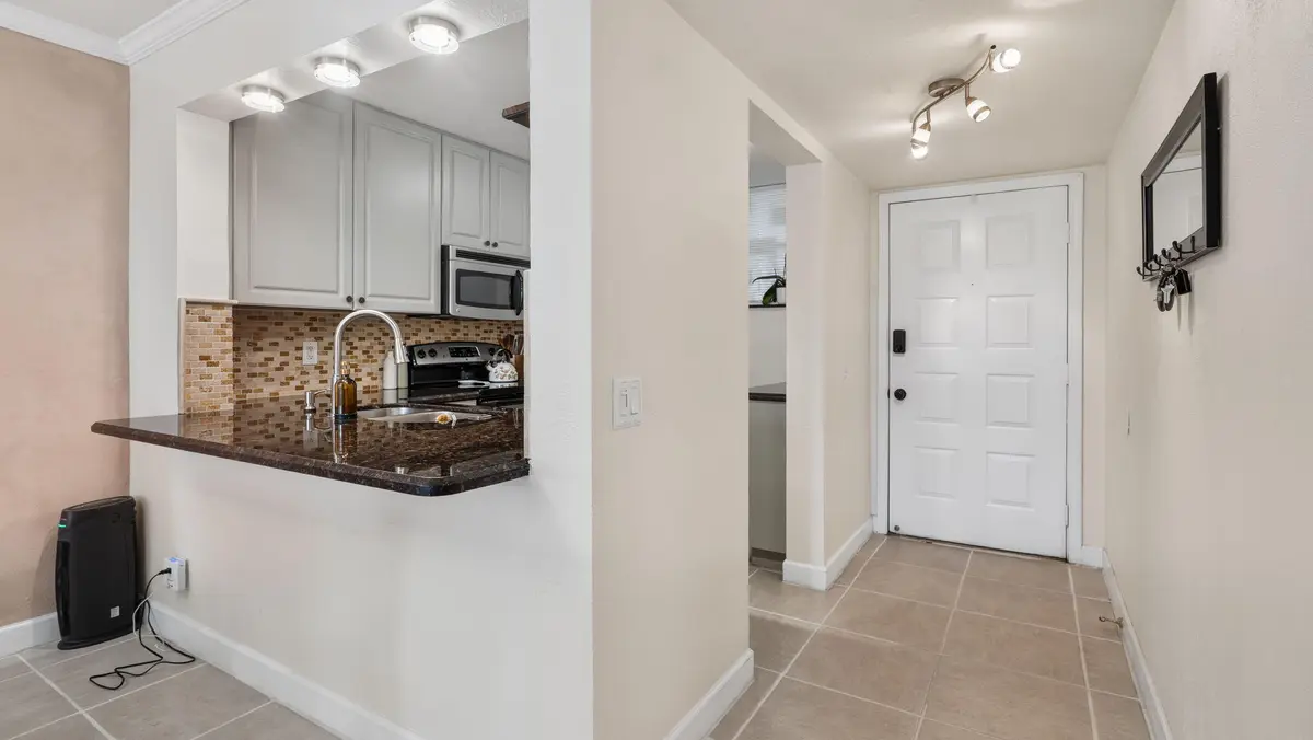 Kitchen Bar- Entrance at 110 Lake Emerald Drive Unit 303, Oakland Park