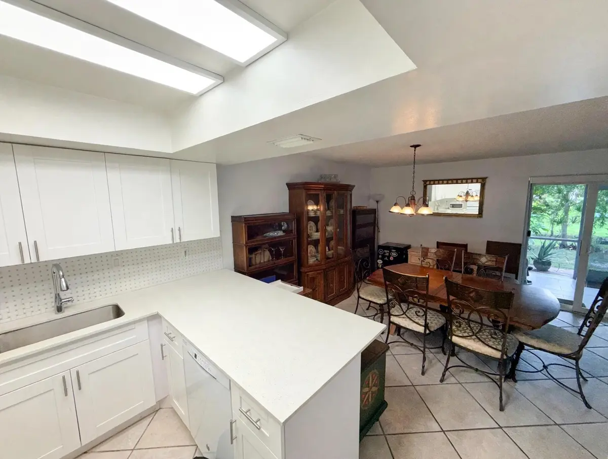 bright_empty_kitchen_dining (1) at 58 ANN LEE Lane, Tamarac