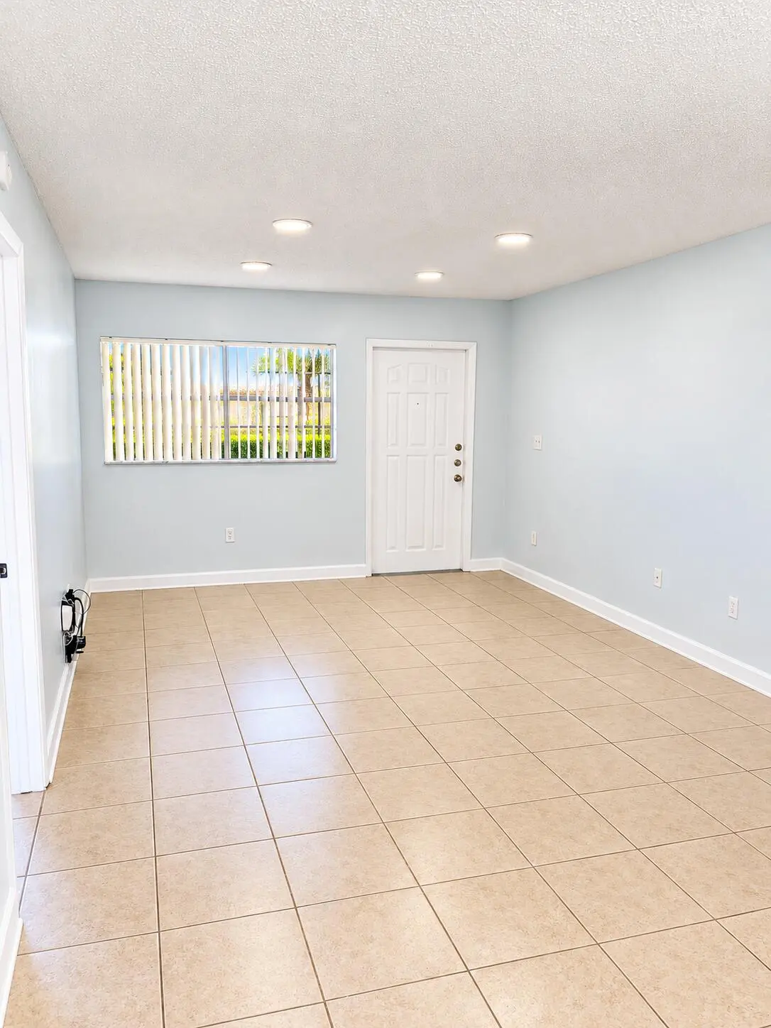 Bright Minimalist Room with Window and D at 18286 MEDITERRANEAN Boulevard 202, Hialeah