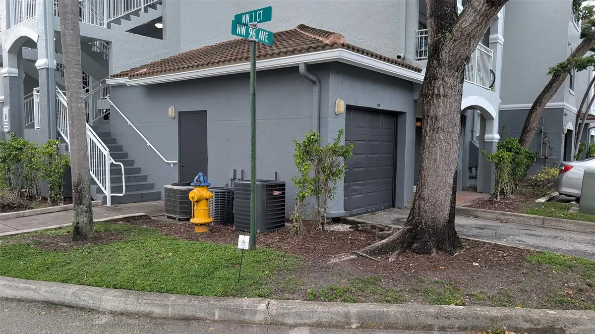 Unit's garage 9-1 and side door at 150 NW 96TH Avenue 9-101, Pembroke Pines