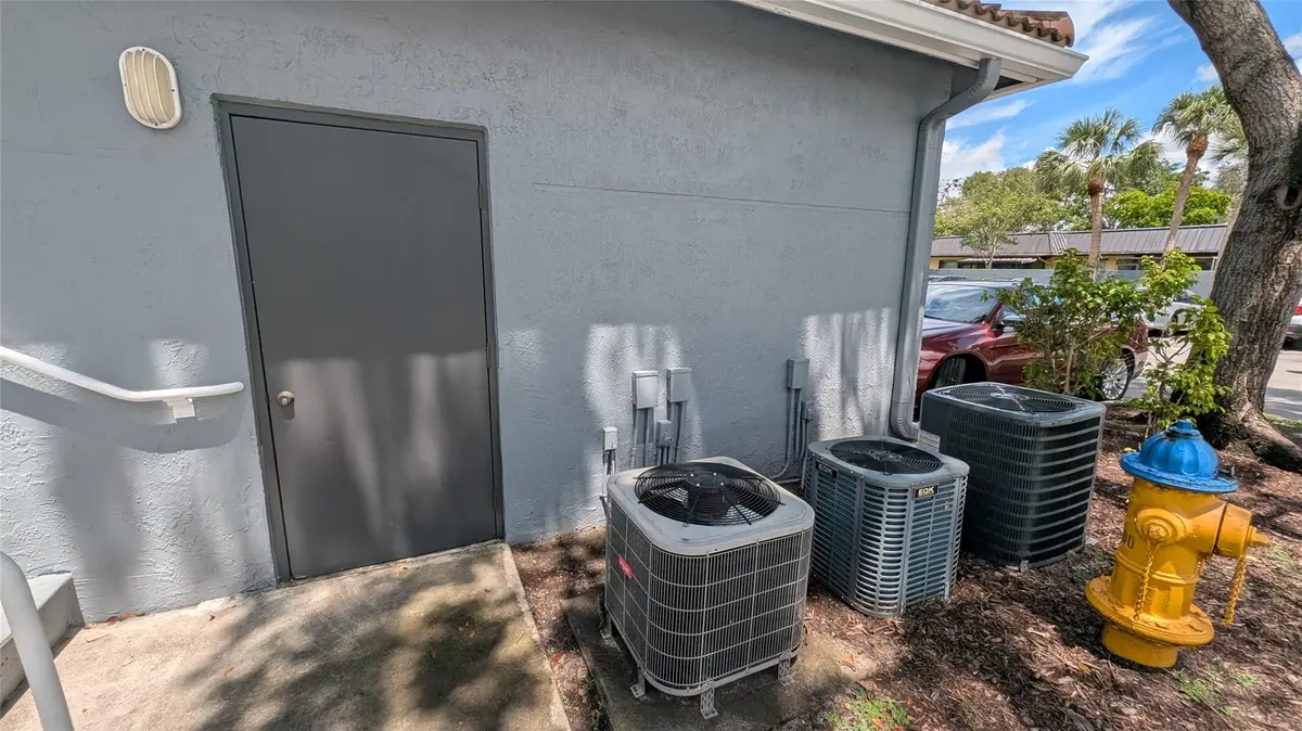 Unit's garage side door at 150 NW 96TH Avenue 9-101, Pembroke Pines