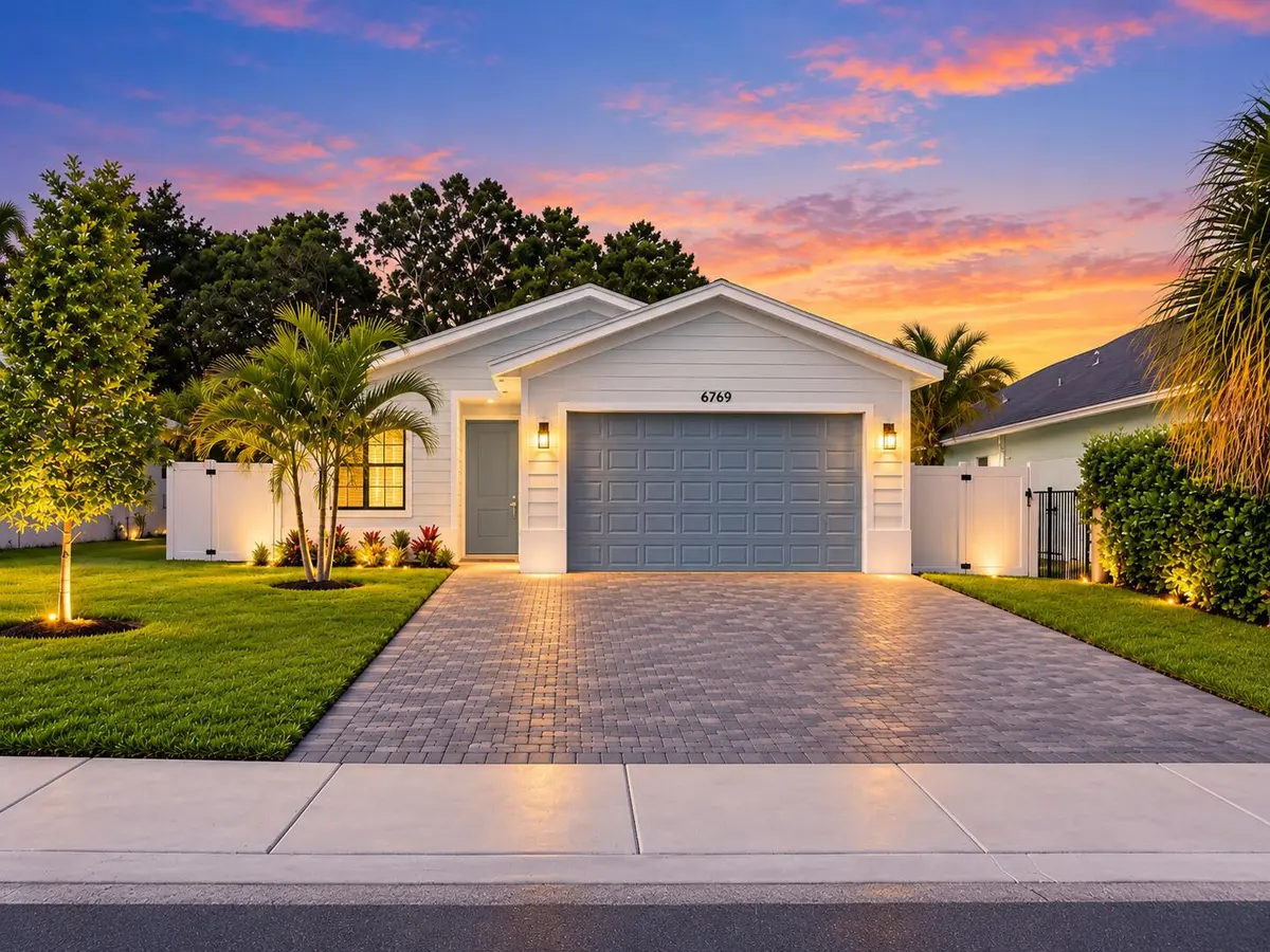 Twilight Coastal Home with Warm Lighting at 6769 MITCHELL Street, Jupiter