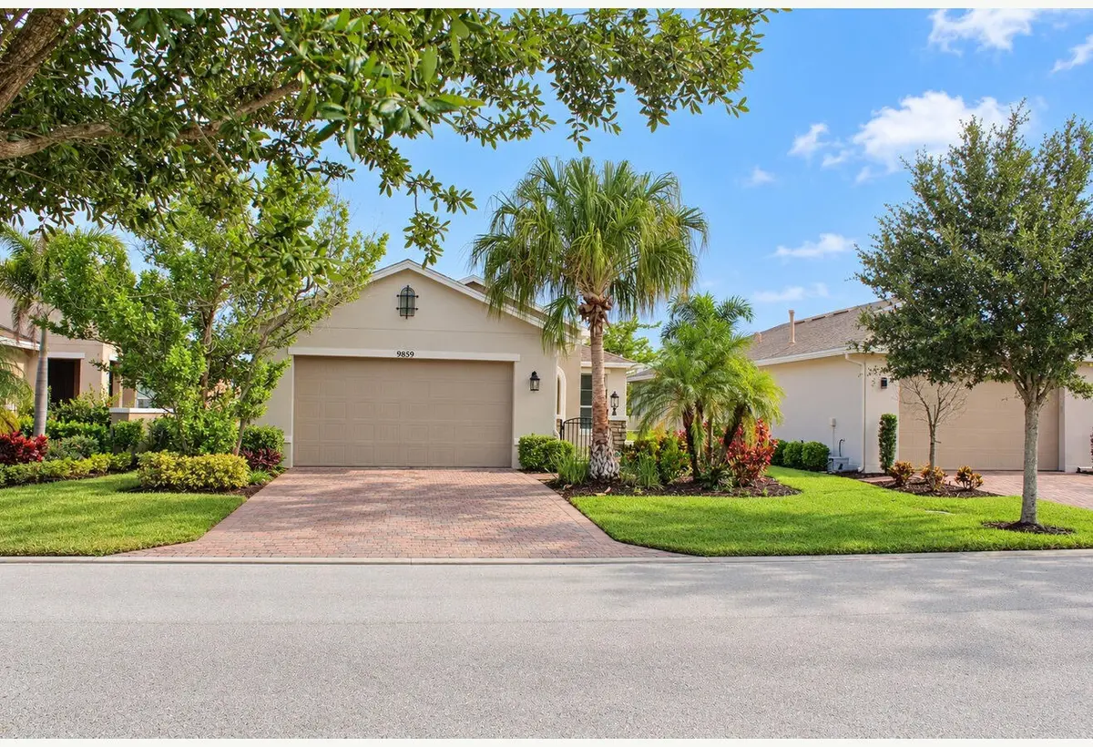 01_DE_Front_exterior_without_driveway_ve at 9859 SW TRUMPET TREE Circle, Port St. Lucie