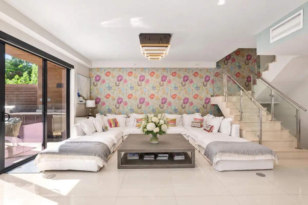 Floral Oasis in a Modern Living Room at 3030 N Ocean Boulevard S106, Fort Lauderdale