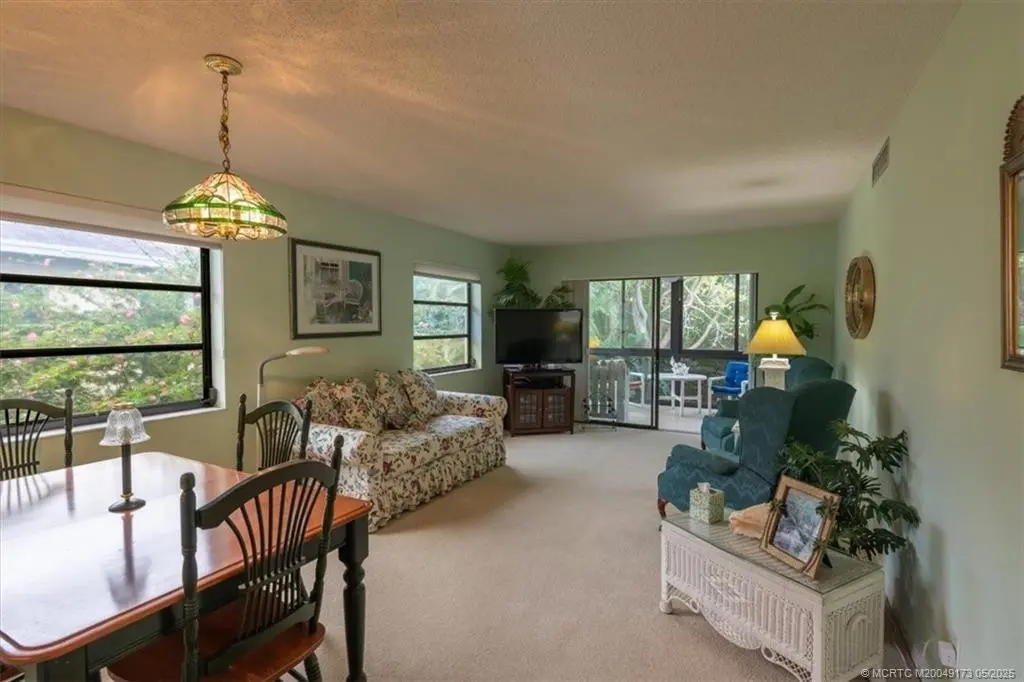Dining Room and Living Room at 2950 SE Ocean Boulevard 128-5, Stuart