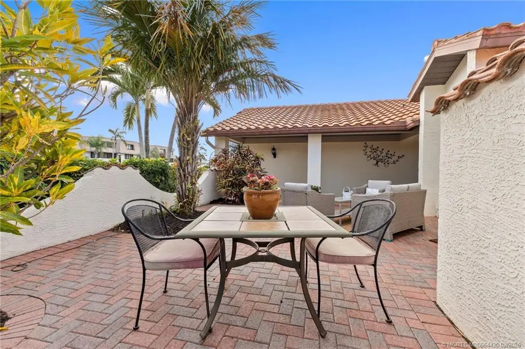Dine al fresco in outside eating area at 1828 SE Coronado Lane, Stuart