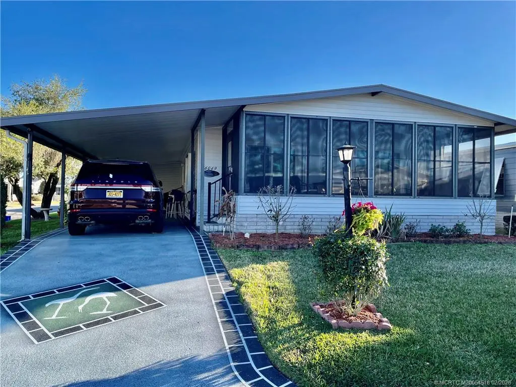 Freshly painted decorative driveway at 16069 SW Indianwood Circle, Indiantown