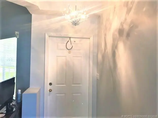 Front door entry at 3486 SW Pindo Palm Lane, Palm City