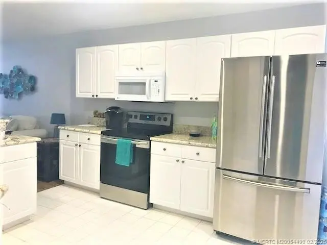 Photo 7 at 3486 SW Pindo Palm Lane, Palm City