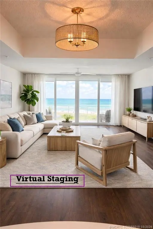 Living area with virtual staging at 579 NE Plantation Road S303, Stuart