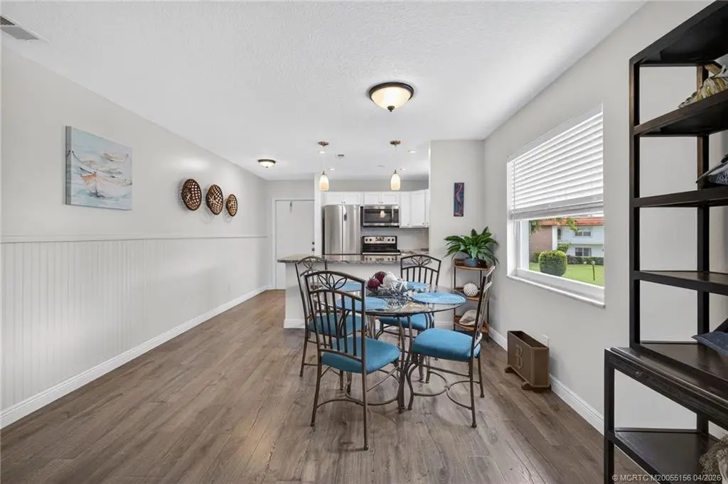 Wainscoting elevates the entryway. at 1225 NW 21st Street 2615, Stuart