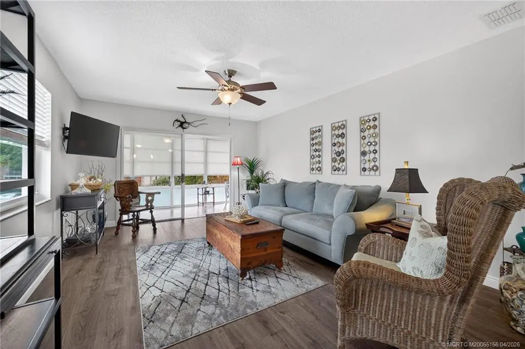 Living area opens to the enclosed lanai. at 1225 NW 21st Street 2615, Stuart