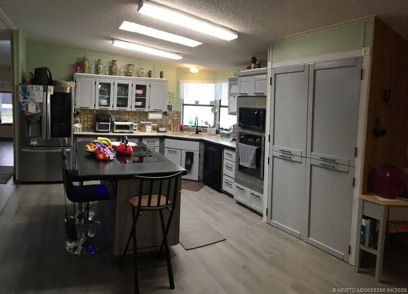 Kitchen at 14391 SW Divot Drive A-40, Indiantown