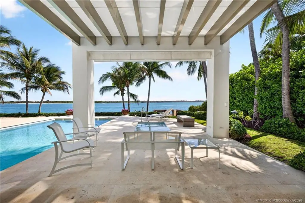 Relax and refresh on this covered patio at 7034 SE Harbor Circle, Stuart