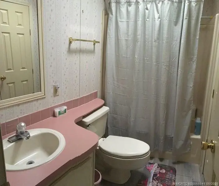 Guest bath room at 16105 SW Indianwood Circle J-30, Indiantown