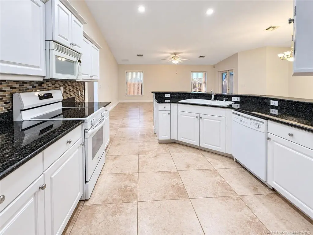 From laundry room toward great room at 446 NE Vanda Terrado, Jensen Beach