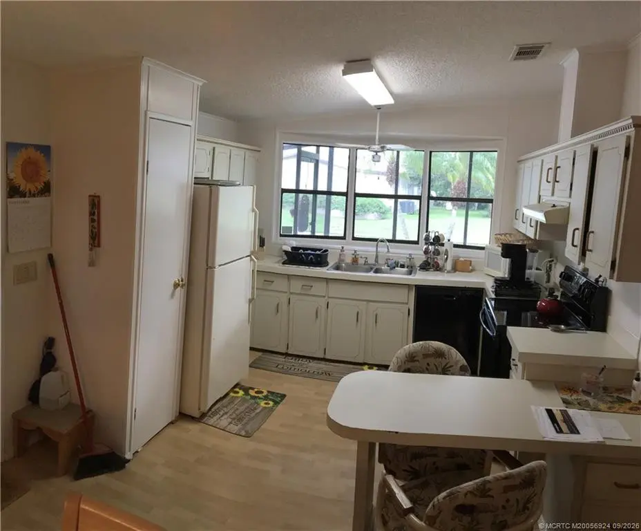 Kitchen at 16404 SW Four Wood Way Q-05, Indiantown