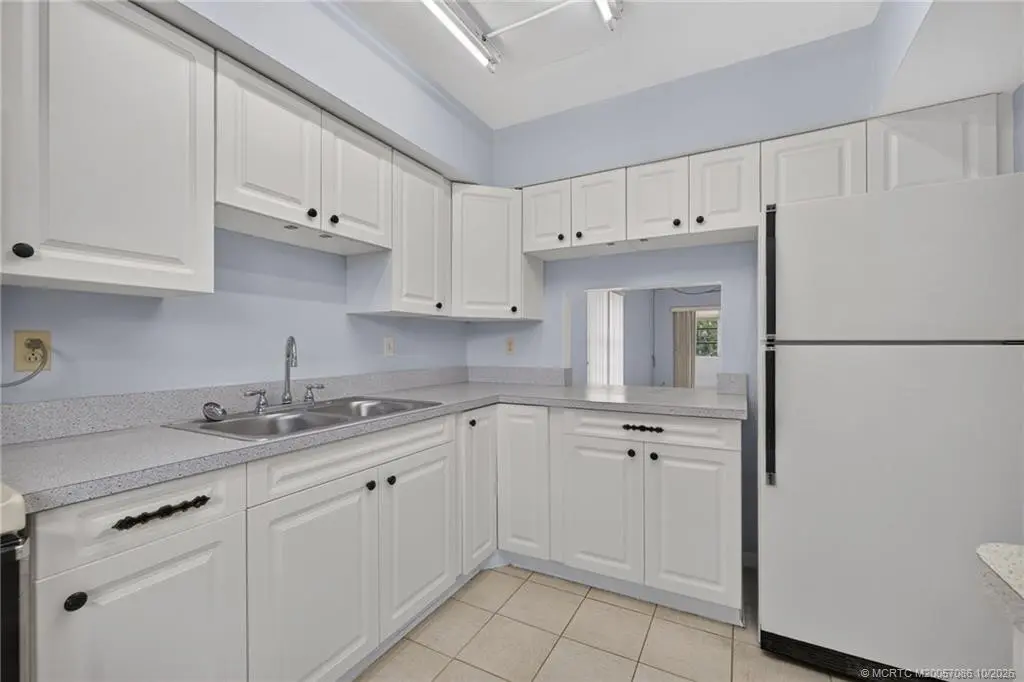 Clean, white kitchen at 1900 S Kanner Highway 7-103, Stuart
