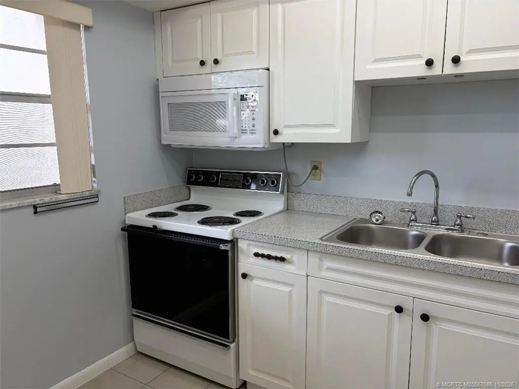 All white kitchen at 1900 S Kanner Highway 7-103, Stuart
