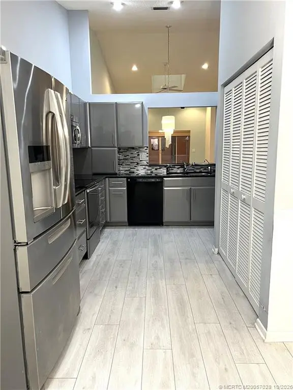 Washer & Dryer in Kitchen area included at 3678 SW Whispering Sound Drive, Palm City