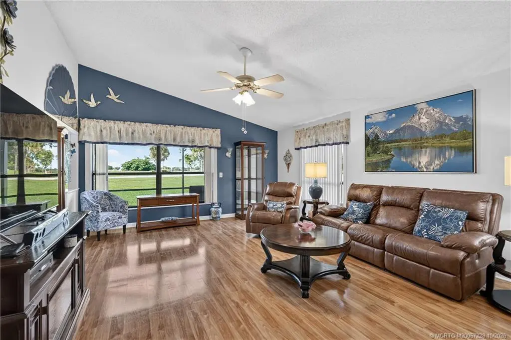 Living room with golf course view at 6865 SE Bunker Hill Drive, Hobe Sound