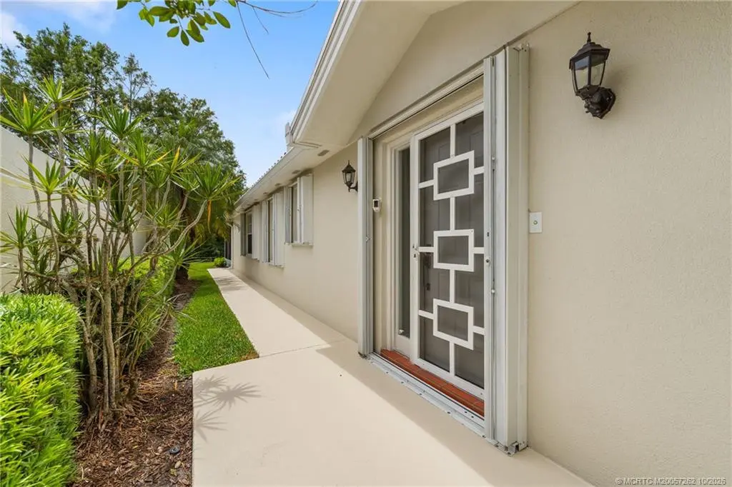 Screened front door at 1602 SW Pineland Way, Palm City