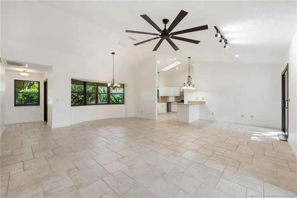 Great room view to kitchen. at 5820 SW Grove Street, Palm City