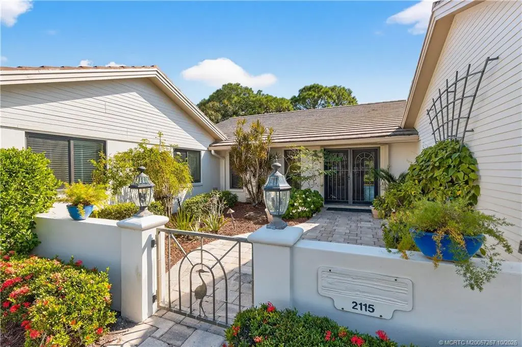 Courtyard into the front at 2115 NW Greenbriar Lane, Palm City