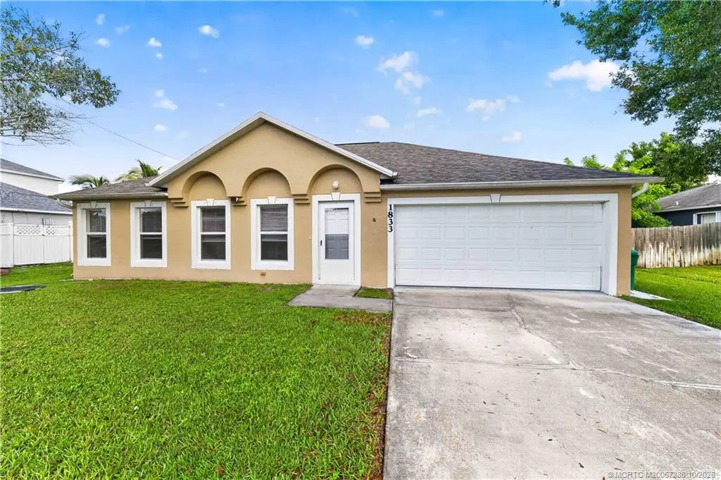 Photo 1 at 1833 SW Lofgren Avenue, Port St. Lucie