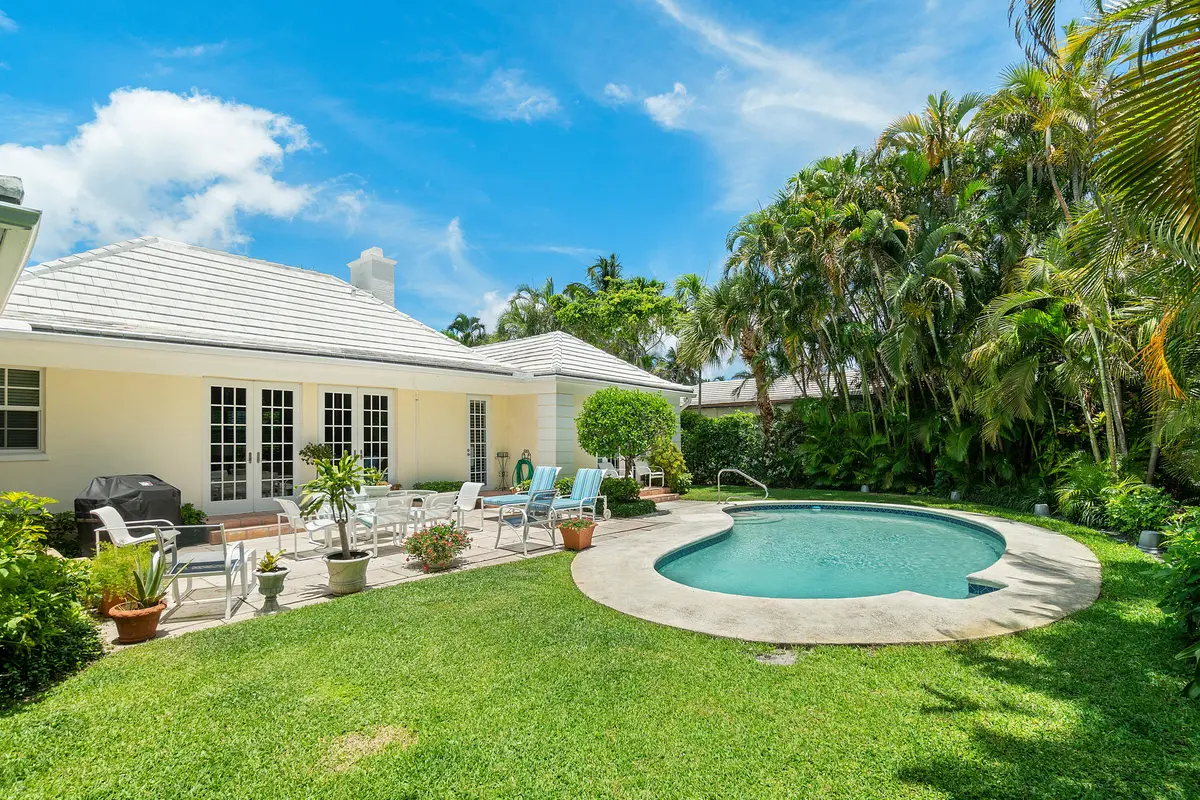 Patio and pool at 230 Plantation Road, Palm Beach