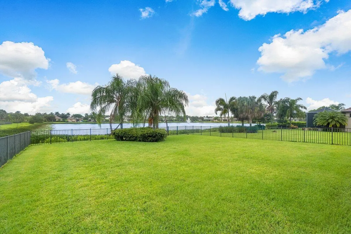 Fenced yard overlooking the pond at 10178 Prato Street, Wellington