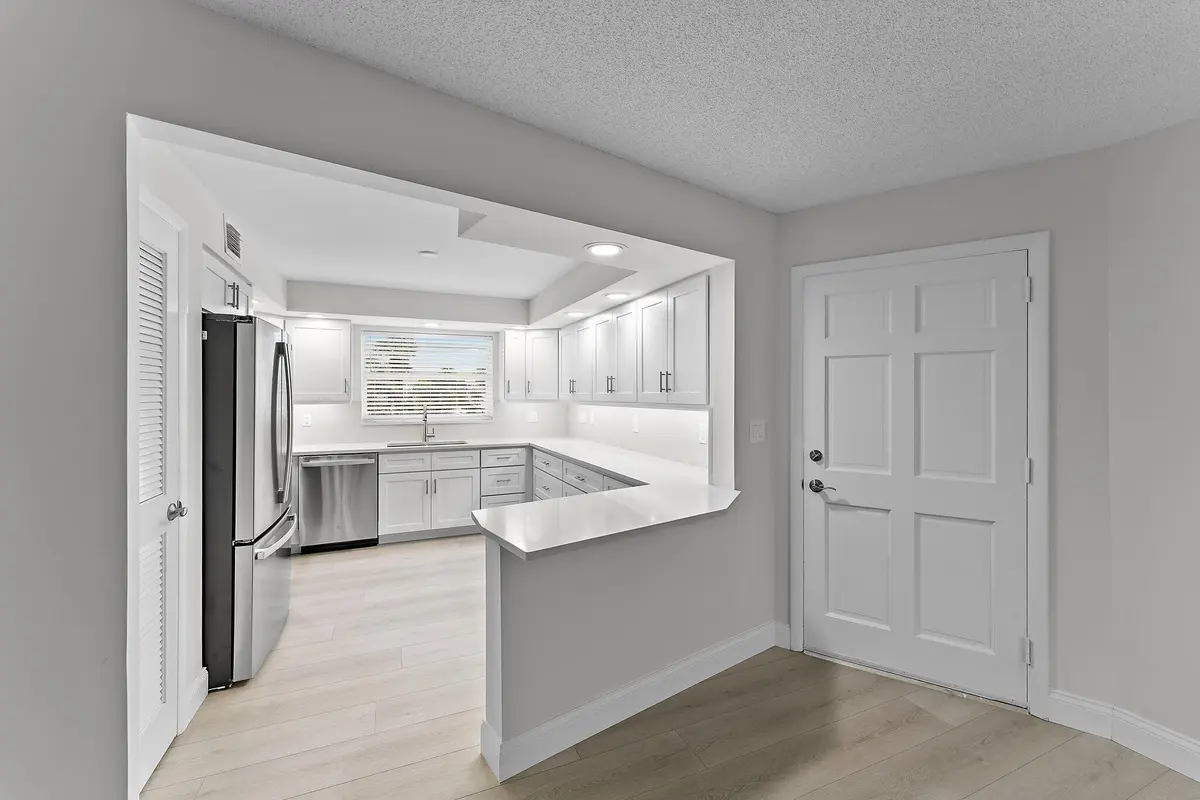 White Shaker Cabinets & Quartz Counters at 20 Celestial Way 215, Juno Beach