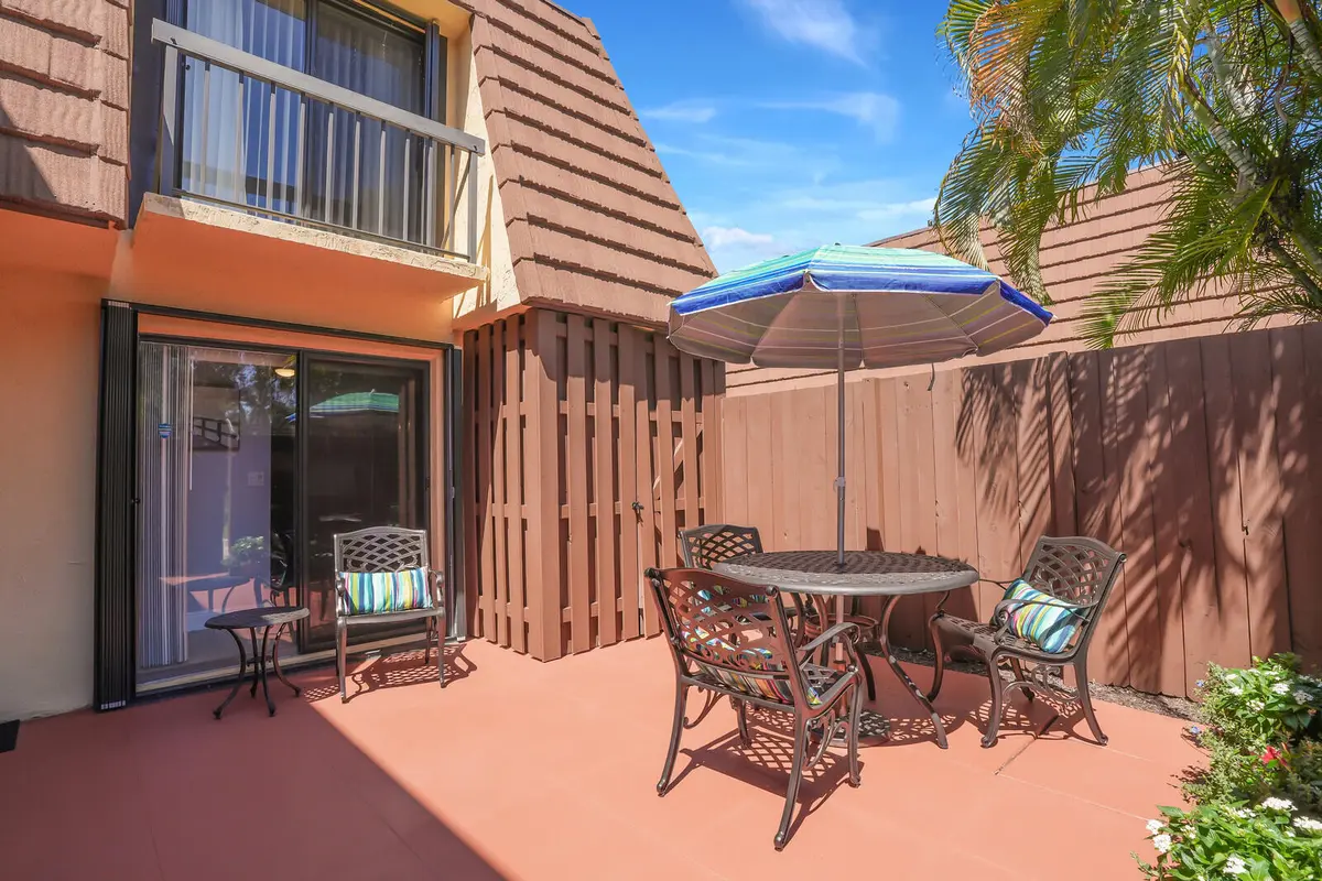 Patio with extended shed at 825 Center Street 14a, Jupiter