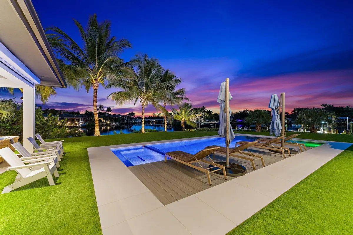 View Across Pool to Water at 18941 SE Reach Island Lane, Jupiter