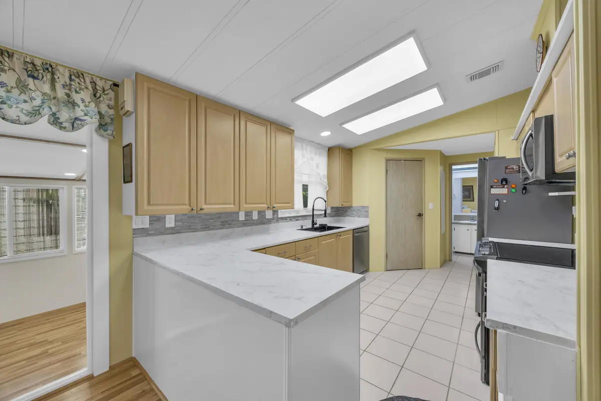 Kitchen looking into front porch. at 7850 SE Shenandoah Drive, Hobe Sound