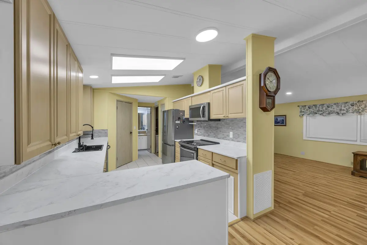 Kitchen looking into living room. at 7850 SE Shenandoah Drive, Hobe Sound