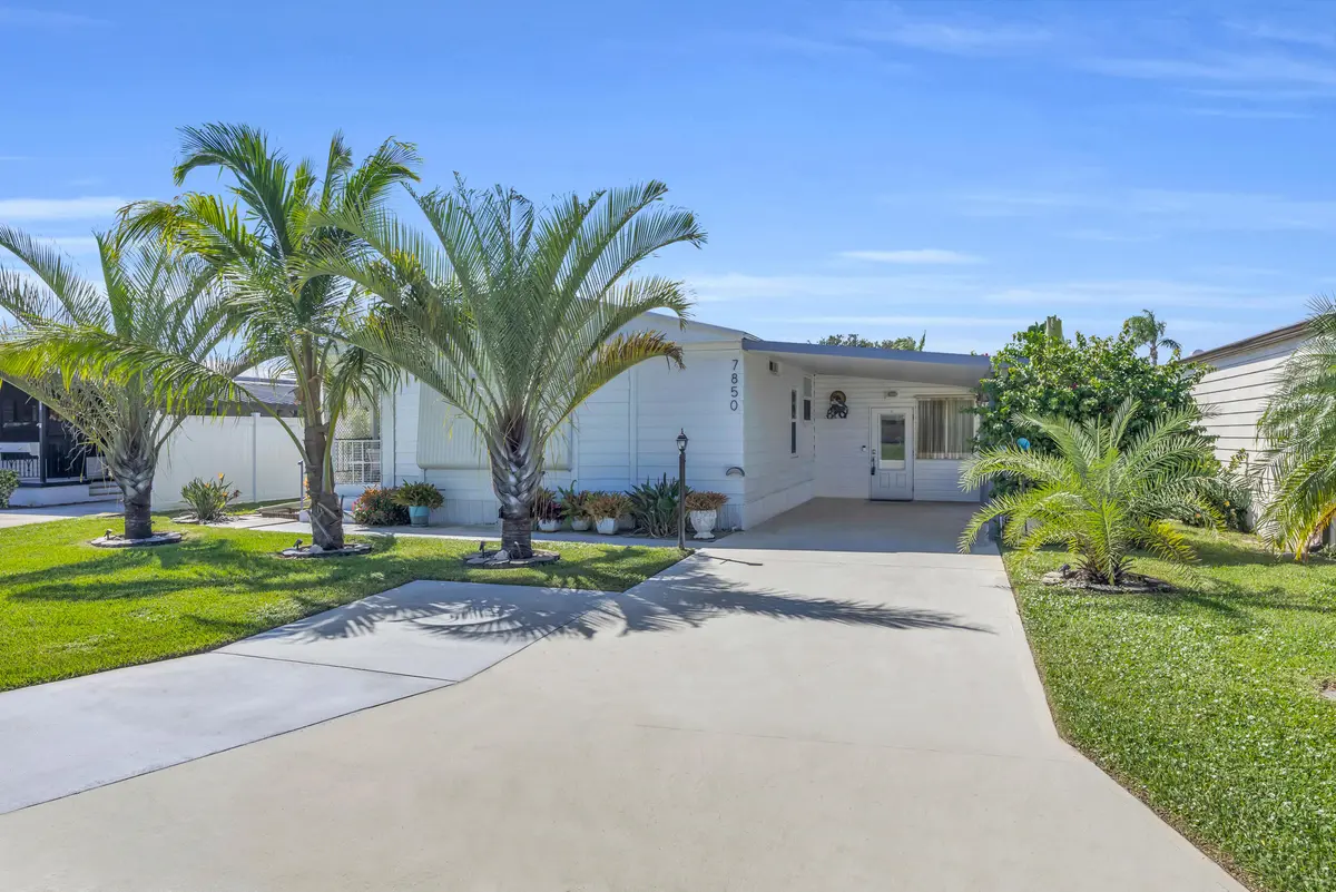 Front of Home with Hurricane Shutters at 7850 SE Shenandoah Drive, Hobe Sound