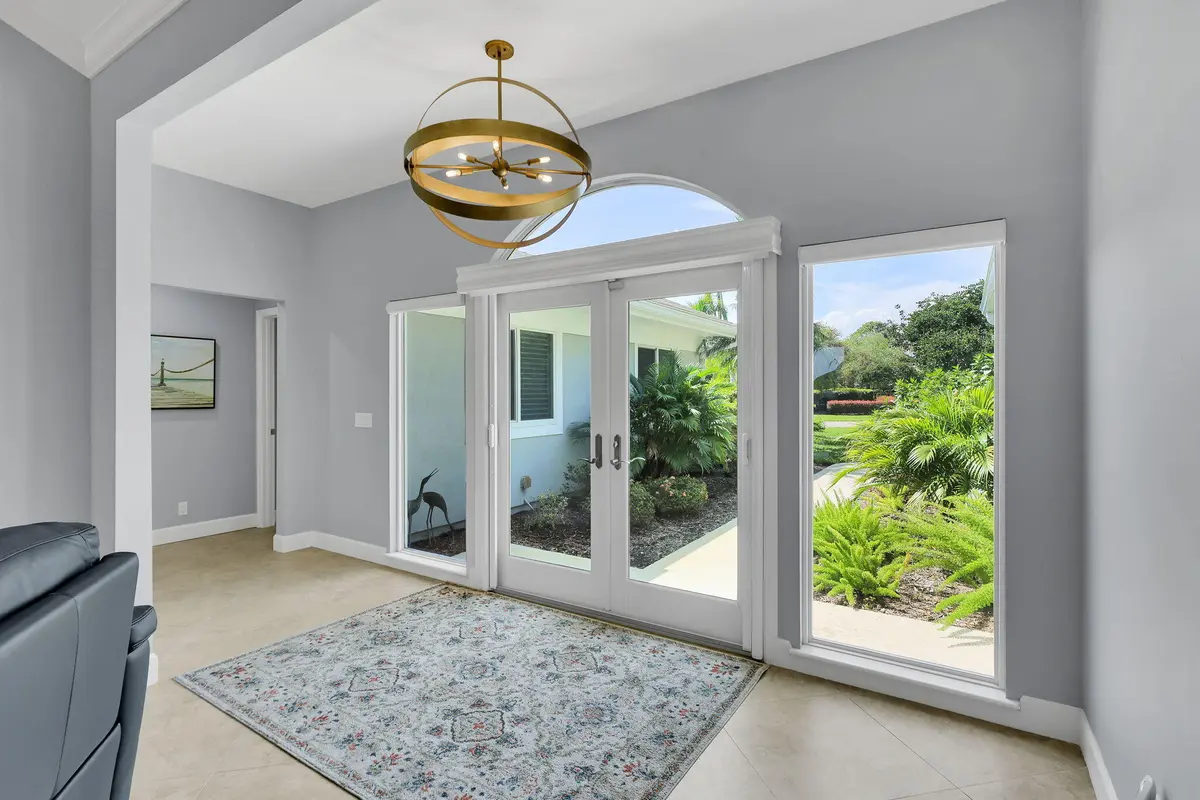 Bright welcoming front entry at 12831 NW Cinnamon Way, Palm City