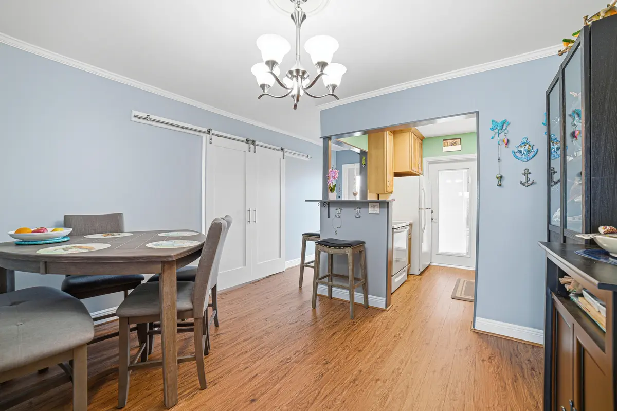 Dining Area Barn Doors Closed at 112 Doolen Court 302, North Palm Beach