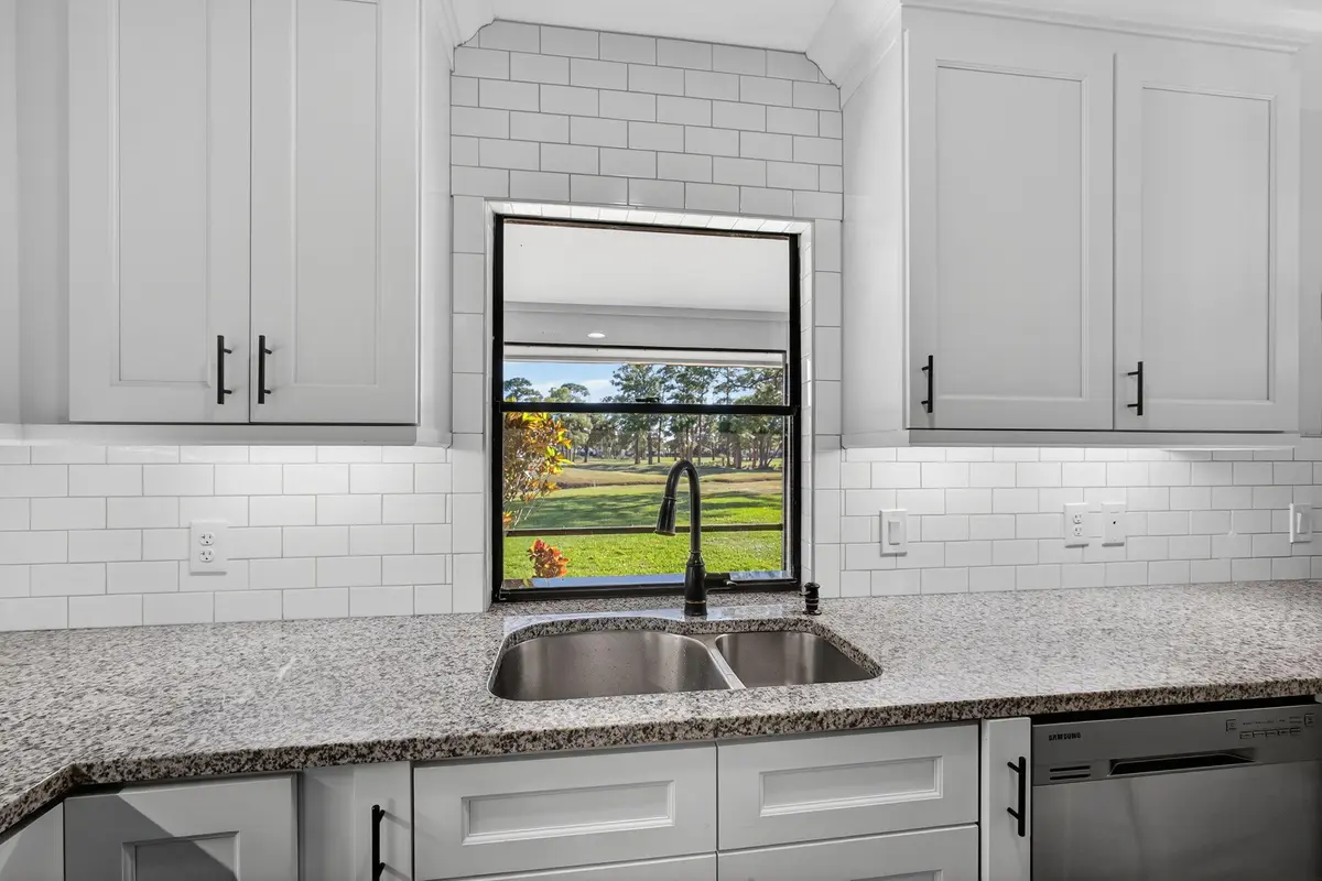Golf course view from kitchen. at 13302 Touchstone Place, Palm Beach Gardens