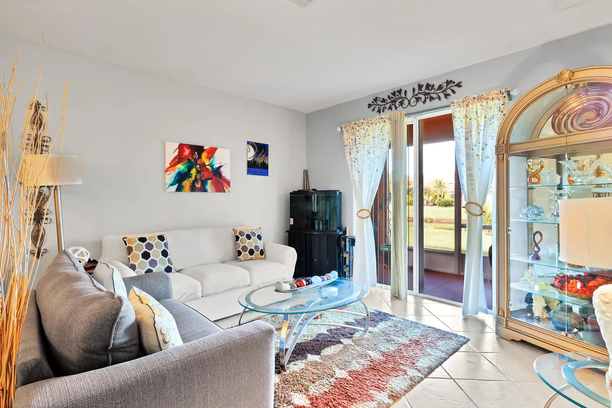 Living Room towards lanai at 6360 Oxford Circle 101, Vero Beach