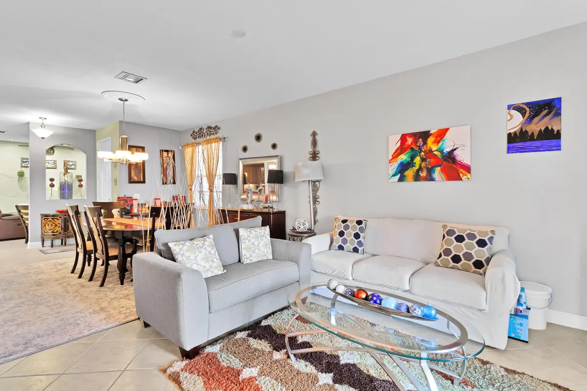 Living Room towards Dining Room at 6360 Oxford Circle 101, Vero Beach