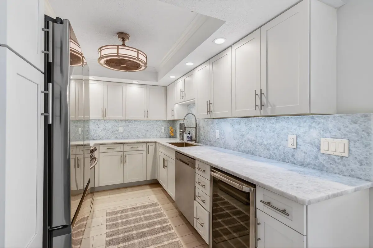 SERENE BLUE COLORS IN UPDATED KITCHEN at 4511 S Ocean Boulevard 403, Highland Beach